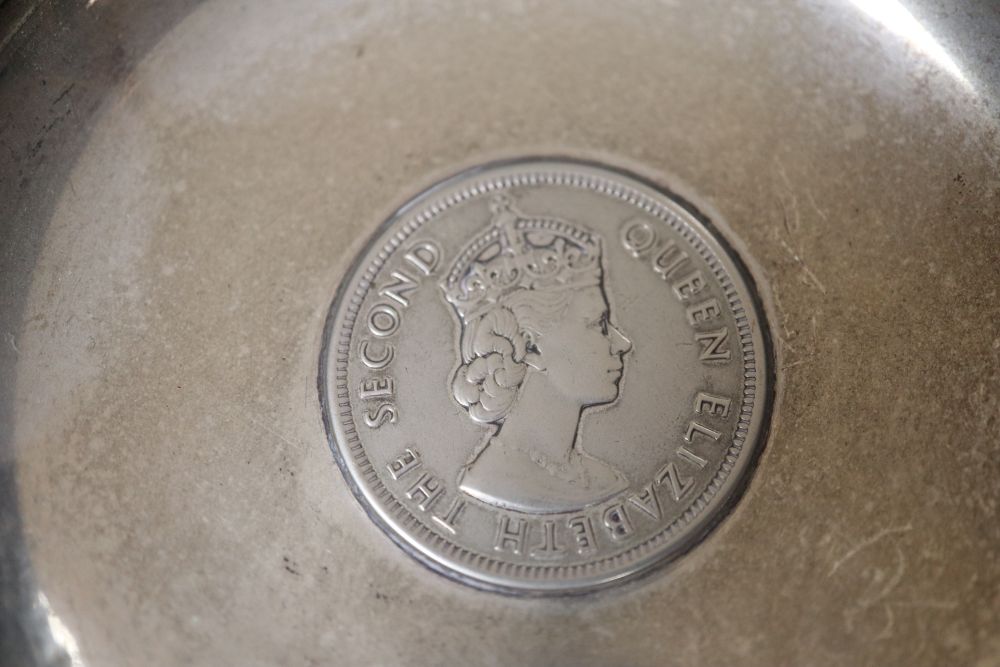 Six Hong Kong sterling dishes, with inset coin and three napkin rings.